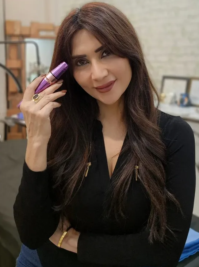 Sonali Bhasin receiving her certification from Victress Beauty Academy